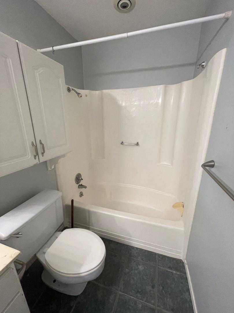 910 Duncan Lane, Unit 44 Austin, TX 78705 - Photo 11 of 15 Functional bathroom featuring practical amenities and durable tile flooring.