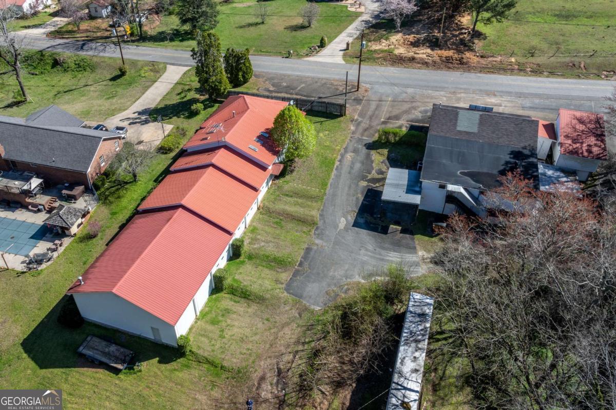 1695 Old Canton Road Ball Ground, GA 30107 - Photo 7 of 43 an aerial view of multiple houses with yard