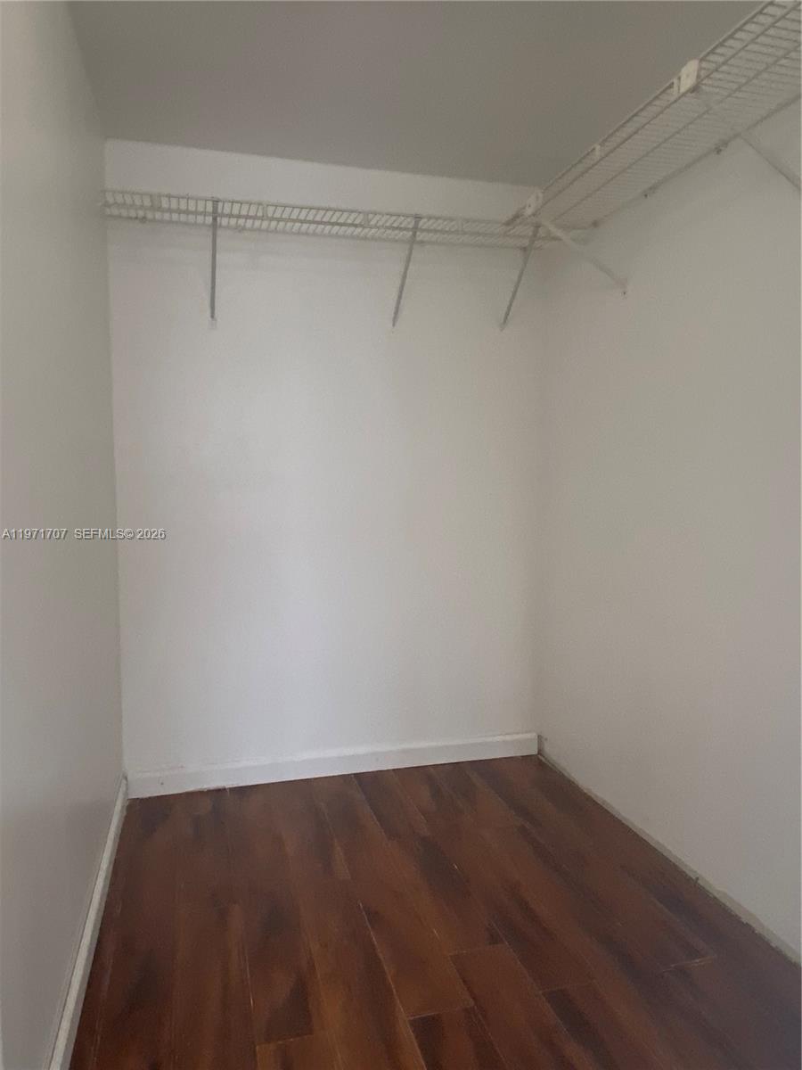 6155 Northwest 186th Street, Unit 308 Hialeah, FL 33015 - Photo 19 of 34 a view of a room with wooden floor