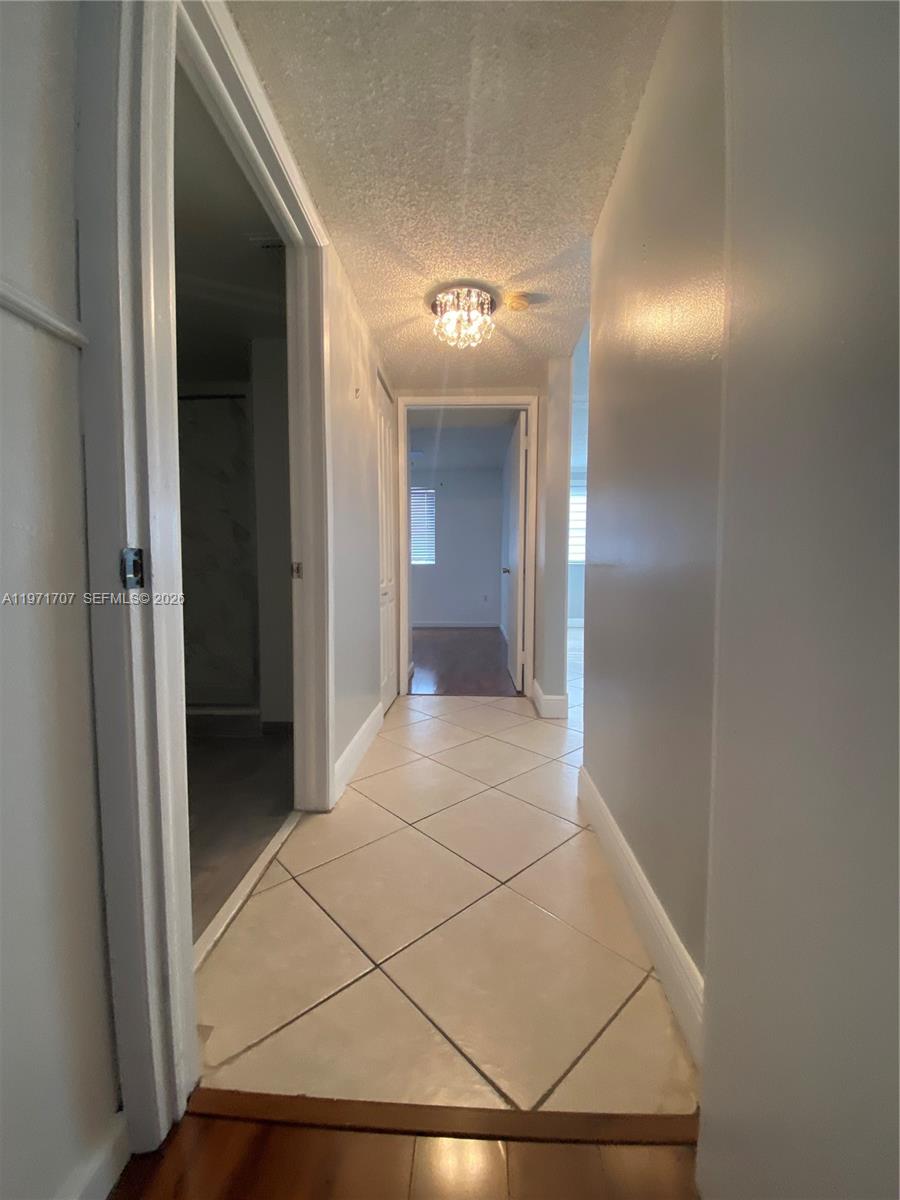 6155 Northwest 186th Street, Unit 308 Hialeah, FL 33015 - Photo 20 of 34 a view of a hallway
