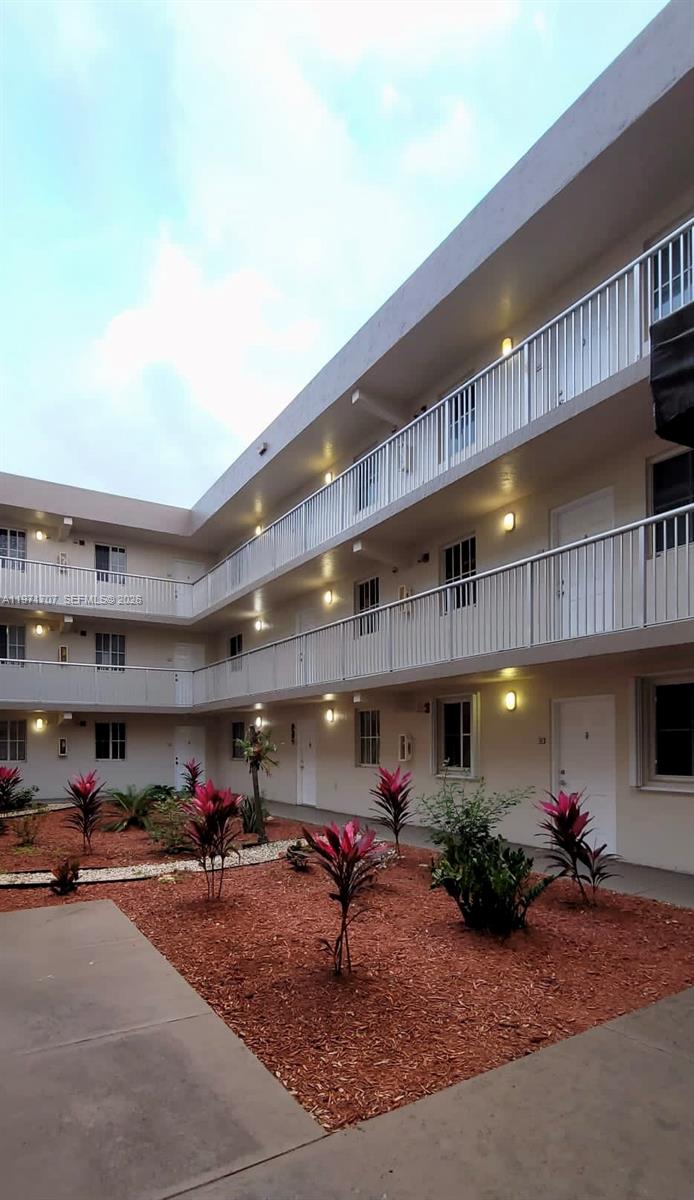 6155 Northwest 186th Street, Unit 308 Hialeah, FL 33015 - Photo 25 of 34 a man sitting on a table in a room