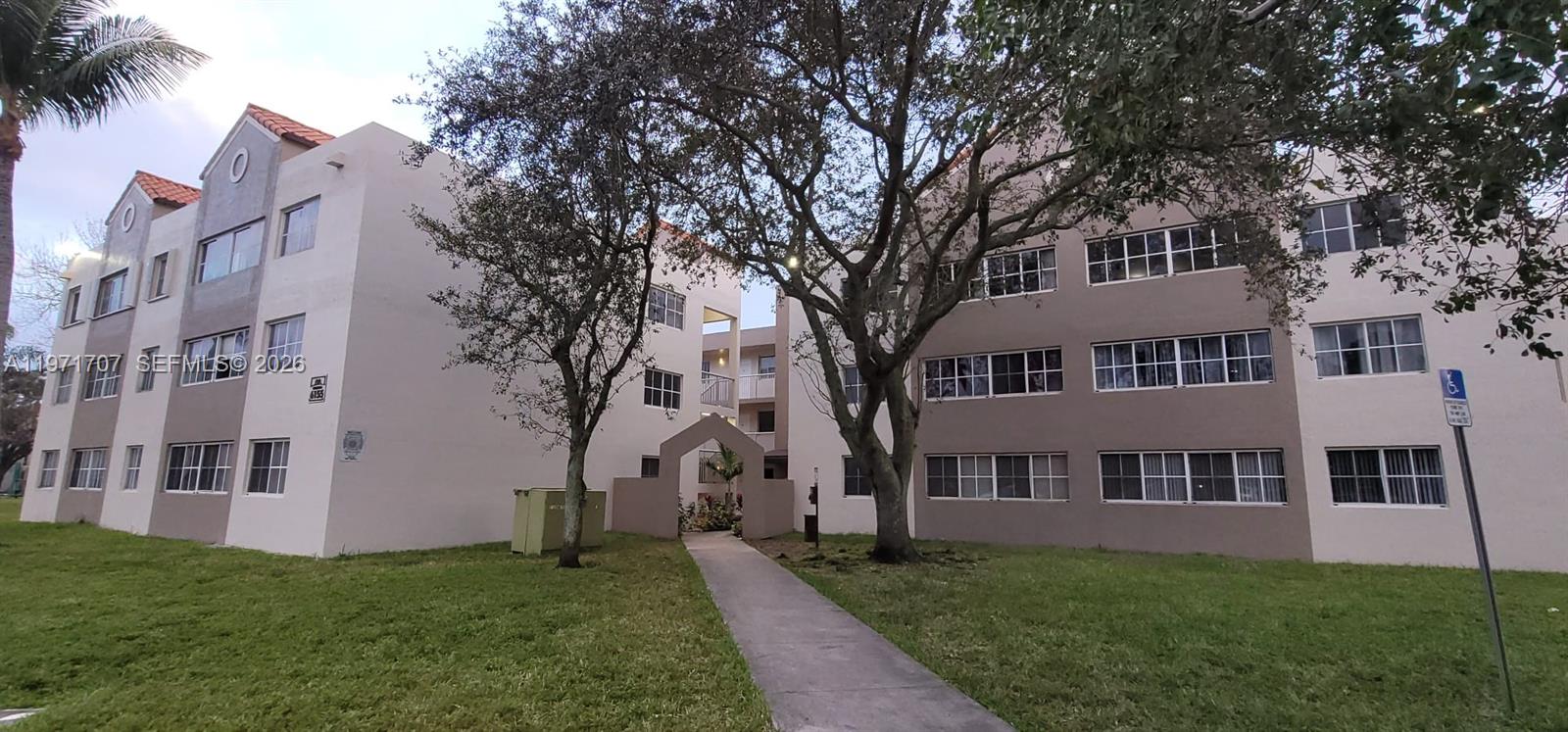 6155 Northwest 186th Street, Unit 308 Hialeah, FL 33015 - Photo 28 of 34 a house view with garden space