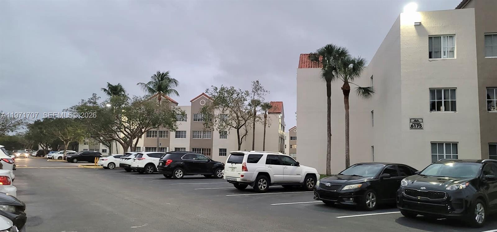 6155 Northwest 186th Street, Unit 308 Hialeah, FL 33015 - Photo 31 of 34 a view of a street in front of a house