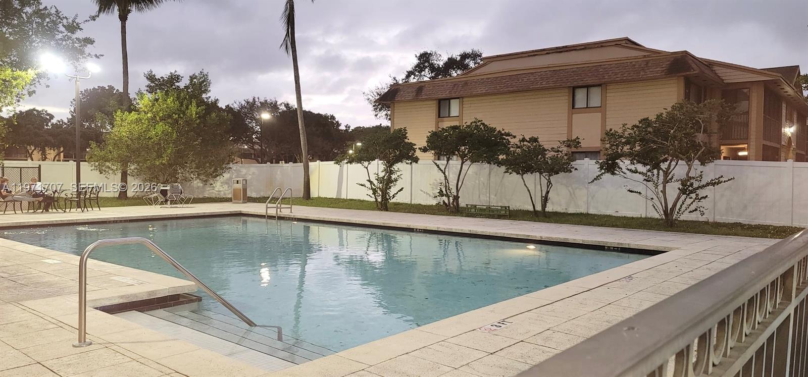 6155 Northwest 186th Street, Unit 308 Hialeah, FL 33015 - Photo 33 of 34 a view of a house with a swimming pool