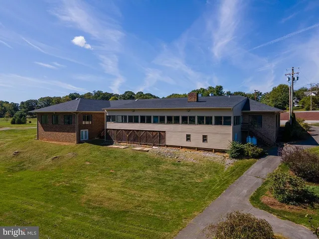 a room with stainless steel appliances a sink and cabinets
