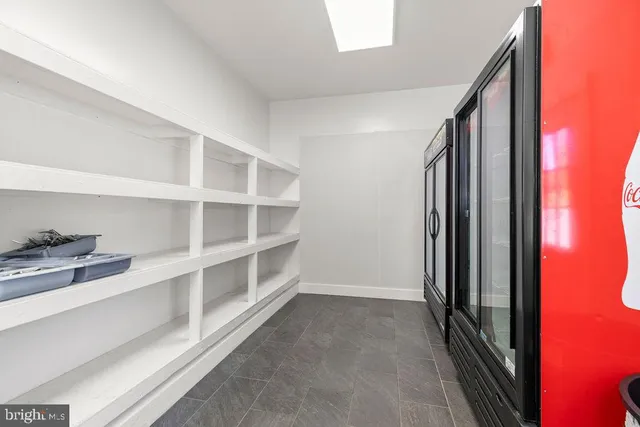 a spacious bathroom with a double vanity sink and a mirror