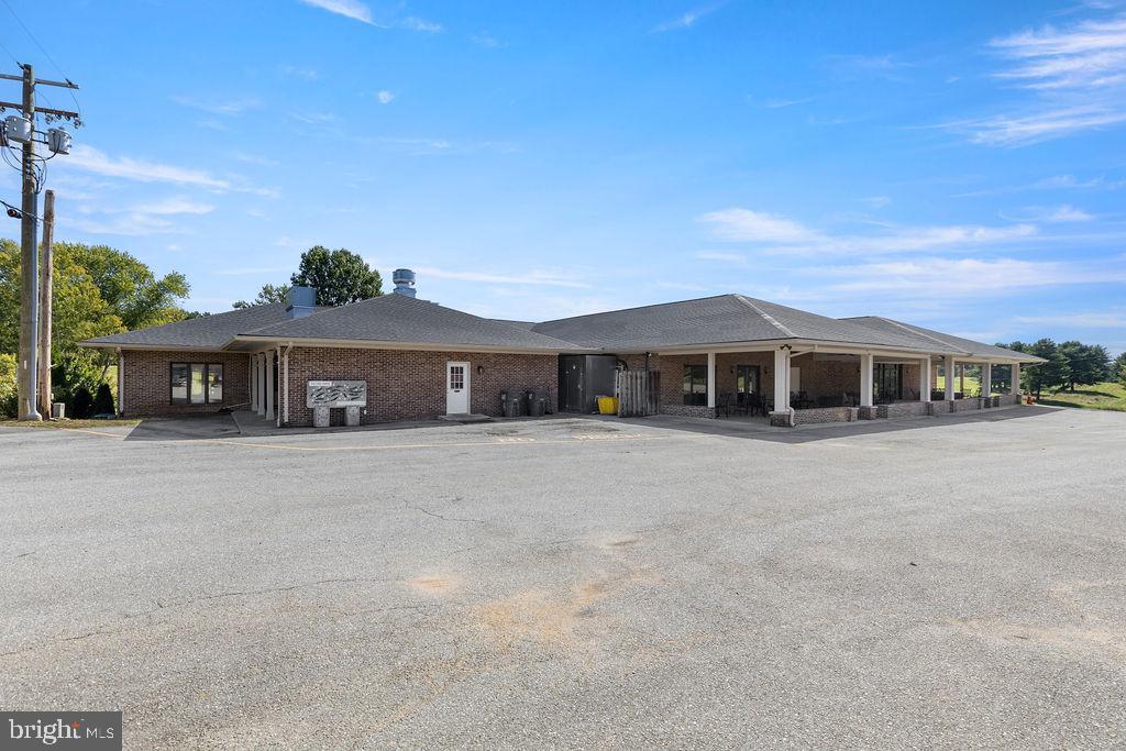 838 Bowling Green Road Front Royal, VA 22630 - Photo 2 of 66 a front view of a house with a yard and a garage