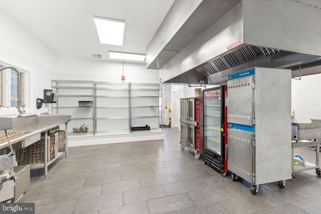 838 Bowling Green Road Front Royal, VA 22630 - Photo 22 of 66 a kitchen with refrigerator and cabinets