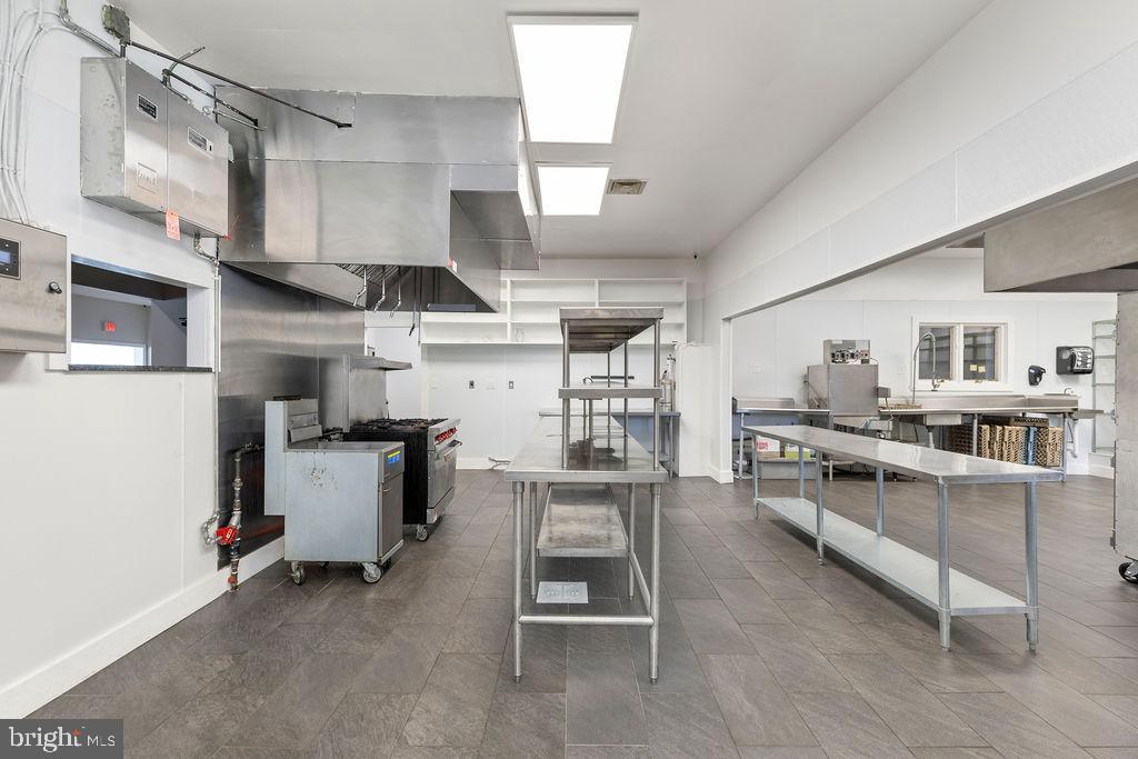 838 Bowling Green Road Front Royal, VA 22630 - Photo 24 of 66 a kitchen with stainless steel appliances a stove a sink dishwasher and cabinets