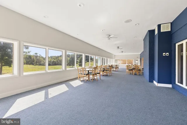 a kitchen with wooden cabinets and a stove top oven