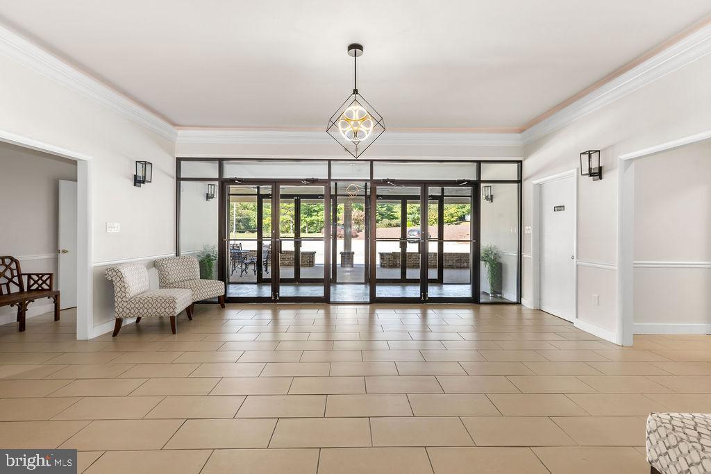 838 Bowling Green Road Front Royal, VA 22630 - Photo 47 of 66 a view of an entryway with floor to ceiling windows and a chandelier