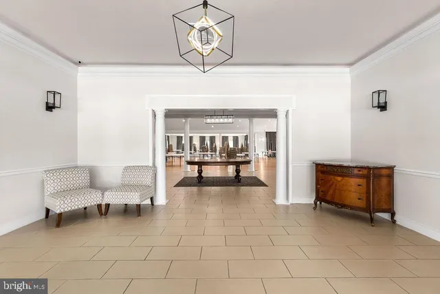 a large house with a big yard and large trees