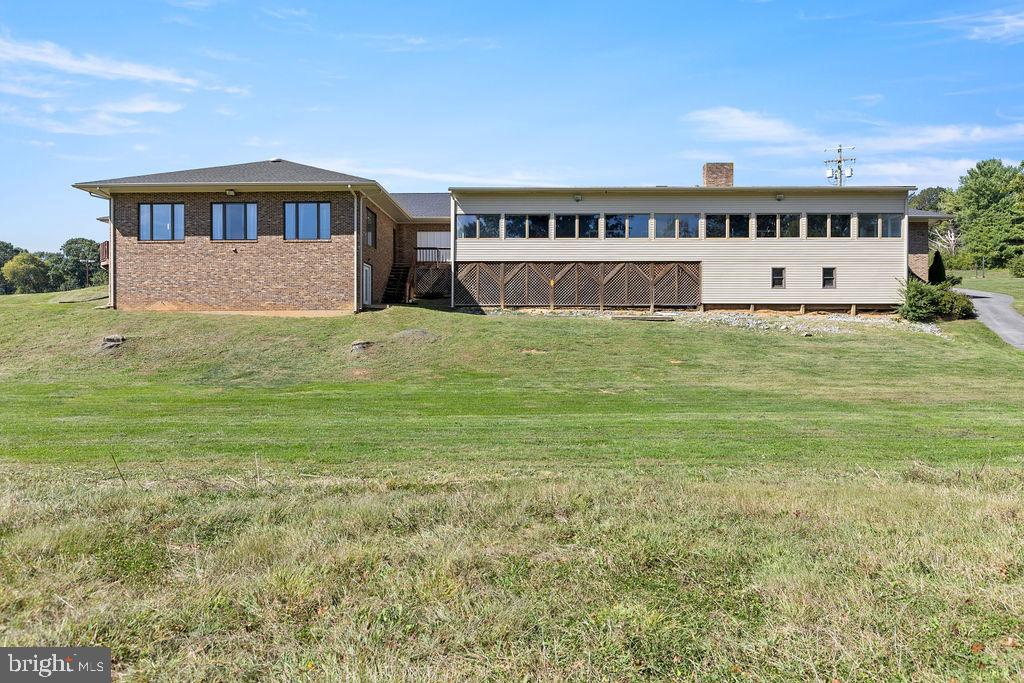 838 Bowling Green Road Front Royal, VA 22630 - Photo 64 of 66 a view of a big house with a big yard
