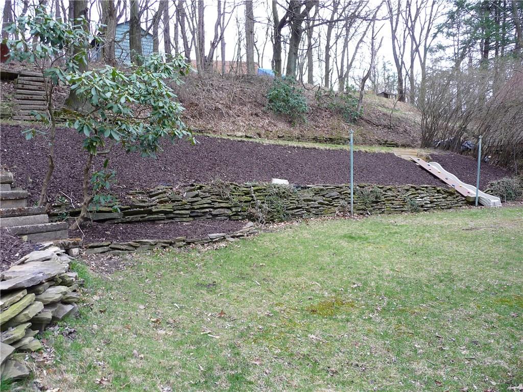 518 Braddock Road Forest Hills, PA 15221 - Photo 20 of 22 Unique back yard needs to be seen to appreciate. Built-in slide runs down the hill. Terraced yard is delightful to the eye and wonderful use of the grounds.