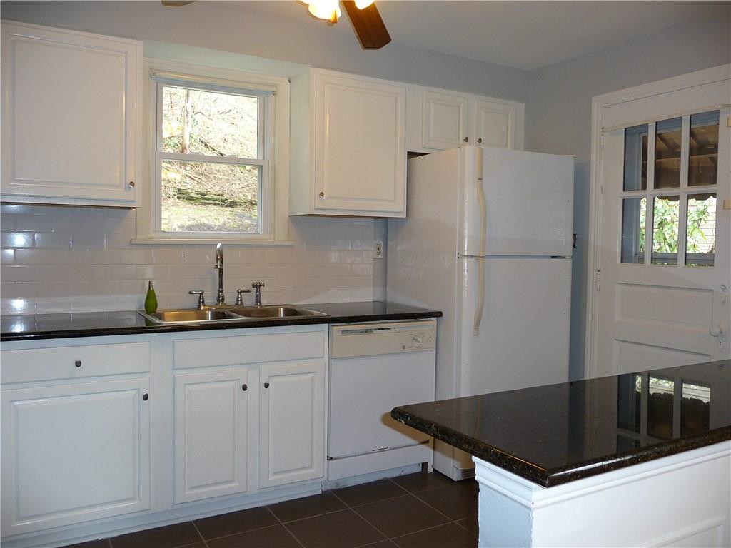 518 Braddock Road Forest Hills, PA 15221 - Photo 4 of 22 Attractive white and black look features newer granite counter tops.