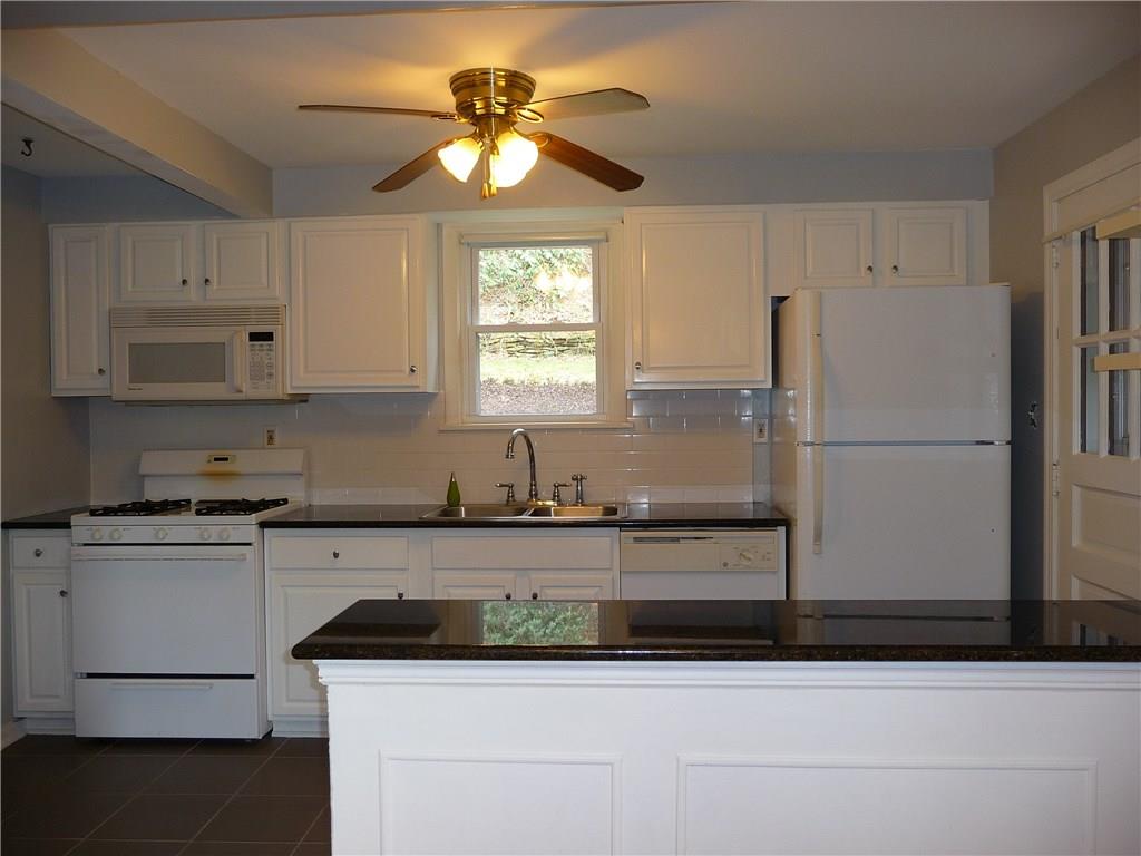 518 Braddock Road Forest Hills, PA 15221 - Photo 6 of 22 Stoop at the side of the kitchen leads to the side and backyard. Ceiling fan for year-round comfort.