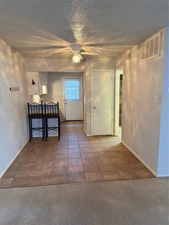 a view of room and a window