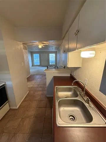 a utility room with a sink a washer and dryer