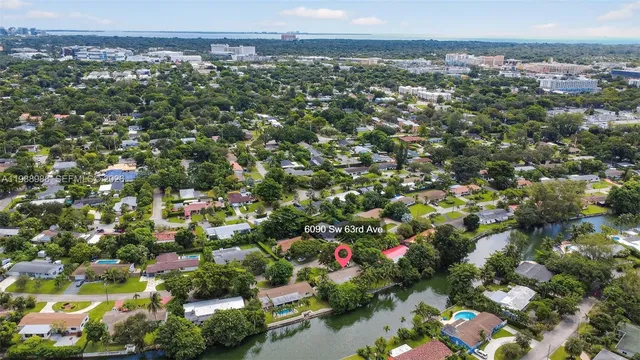an aerial view of residential house with outdoor space and lake view