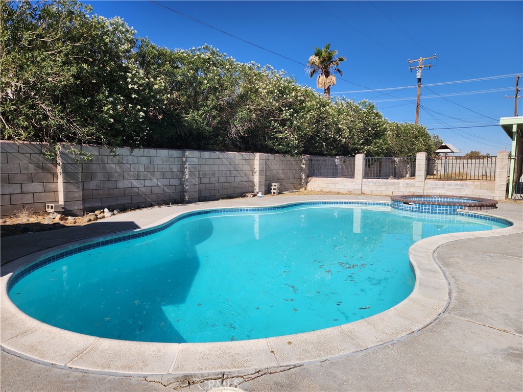 28035 Bonanza Road Barstow, CA 92311 - Photo 24 of 29 a view of a swimming pool with a sitting area