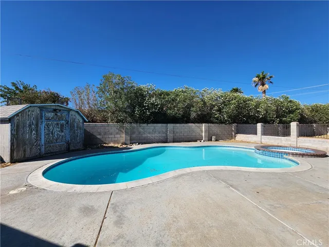 a view of outdoor space and swimming pool