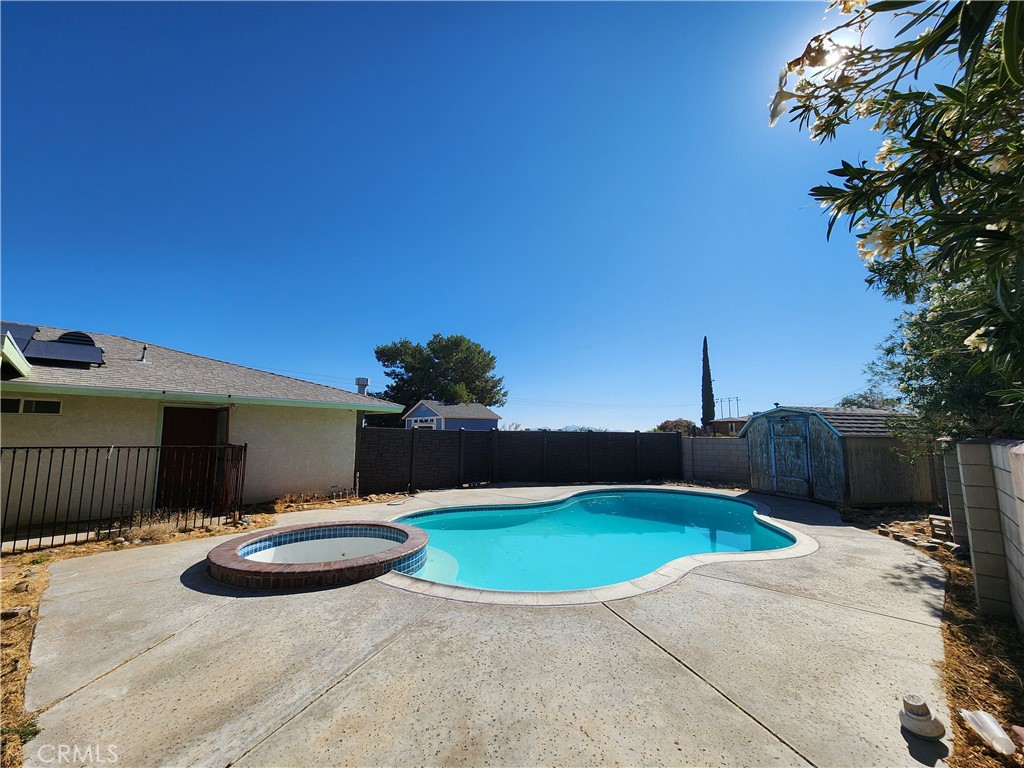 28035 Bonanza Road Barstow, CA 92311 - Photo 26 of 29 a view of a backyard with a table and chair a barbeque