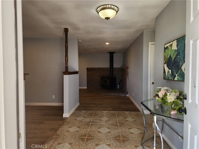 a view of hallway with furniture and a potted plant