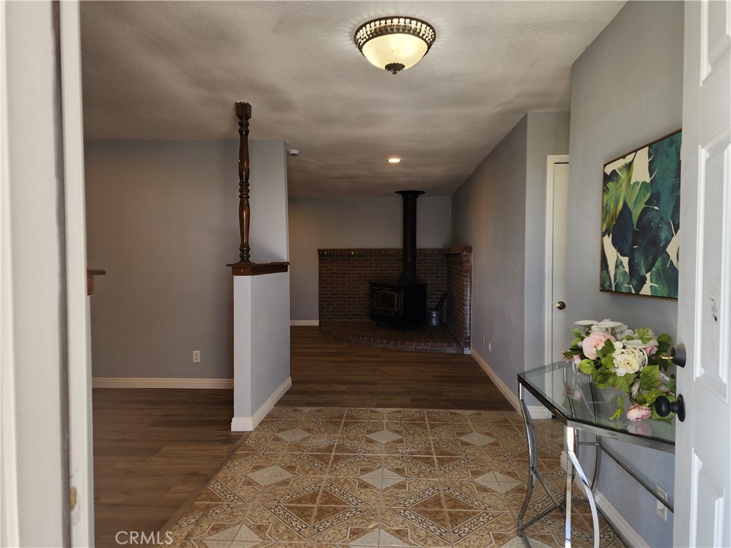 28035 Bonanza Road Barstow, CA 92311 - Photo 4 of 29 a view of hallway with furniture and a potted plant