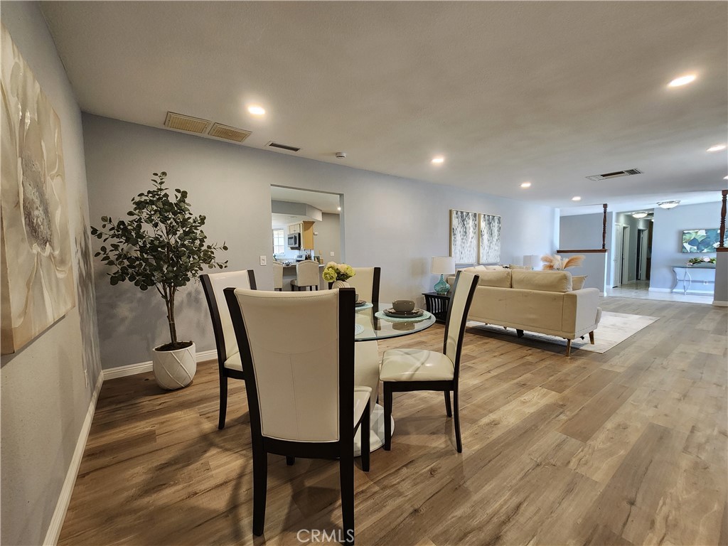 28035 Bonanza Road Barstow, CA 92311 - Photo 9 of 29 a dining room with furniture and wooden floor