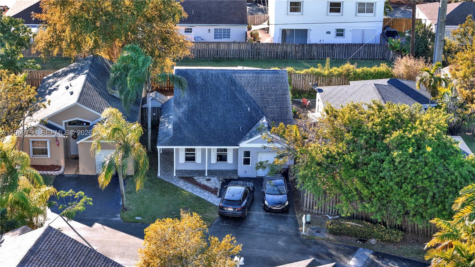 14600 Southwest 124th Place Miami, FL 33186 - Photo 4 of 34 an aerial view of a house with a yard and a large tree
