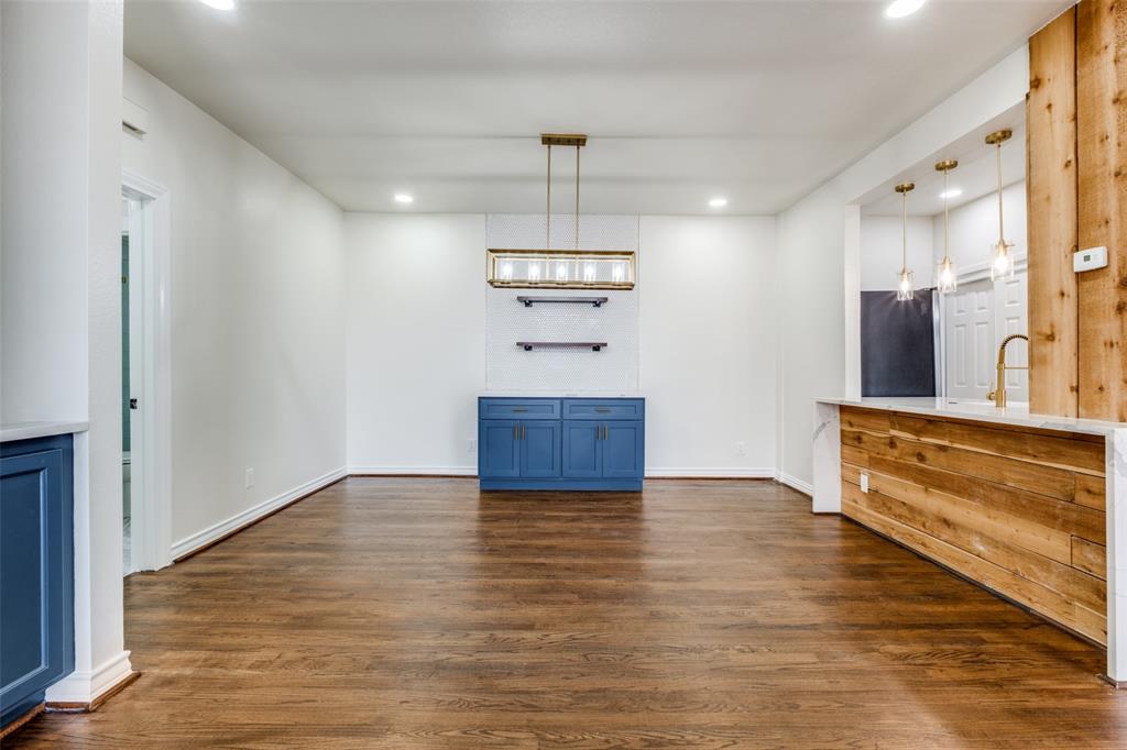 3208 Cole Avenue, Unit 2202 Dallas, TX 75204 - Photo 8 of 26 a view of a kitchen with a sink and a refrigerator