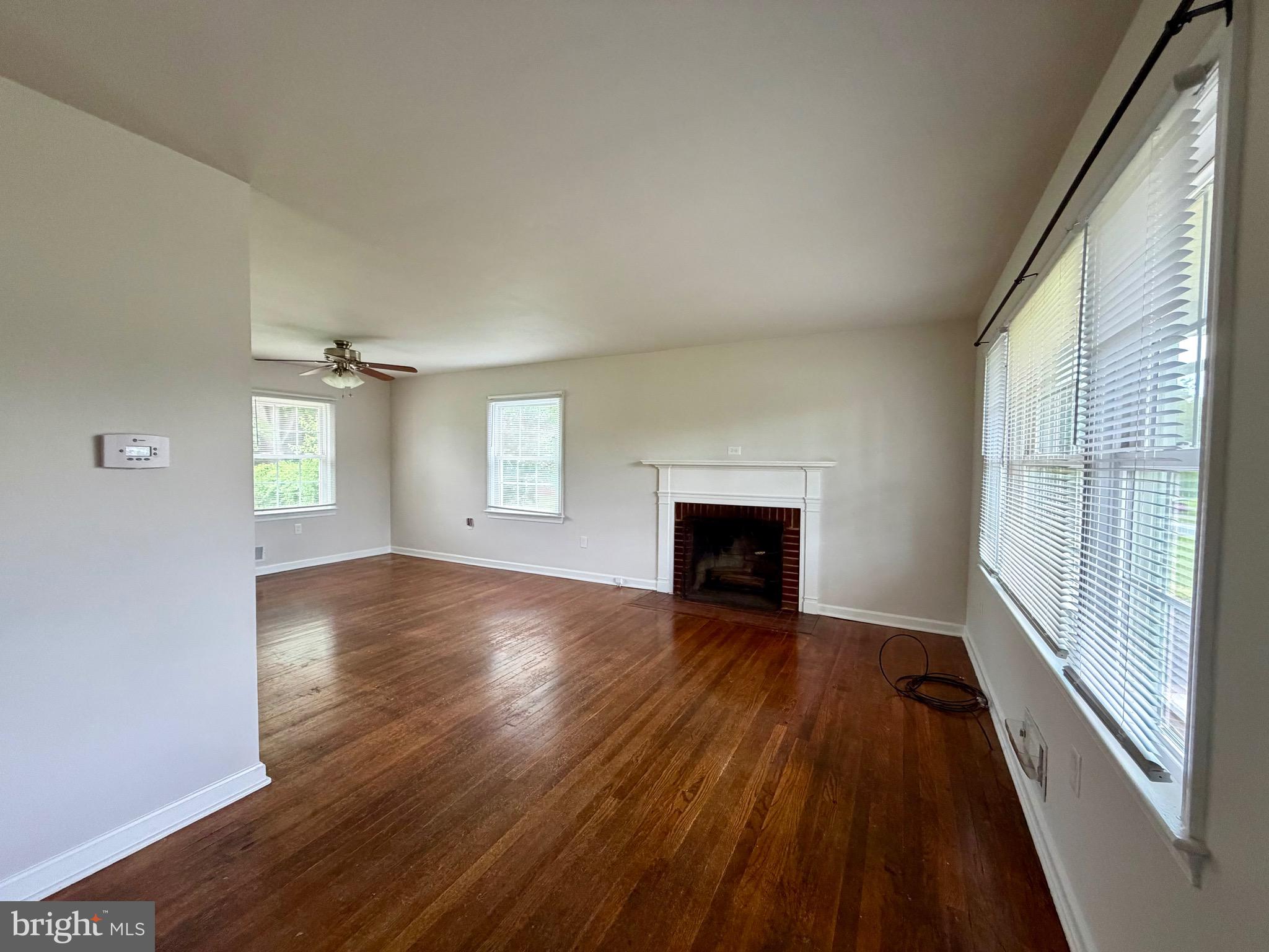 1010 Nottingham Street Culpeper, VA 22701 - Photo 13 of 21 an empty room with wooden floor and windows
