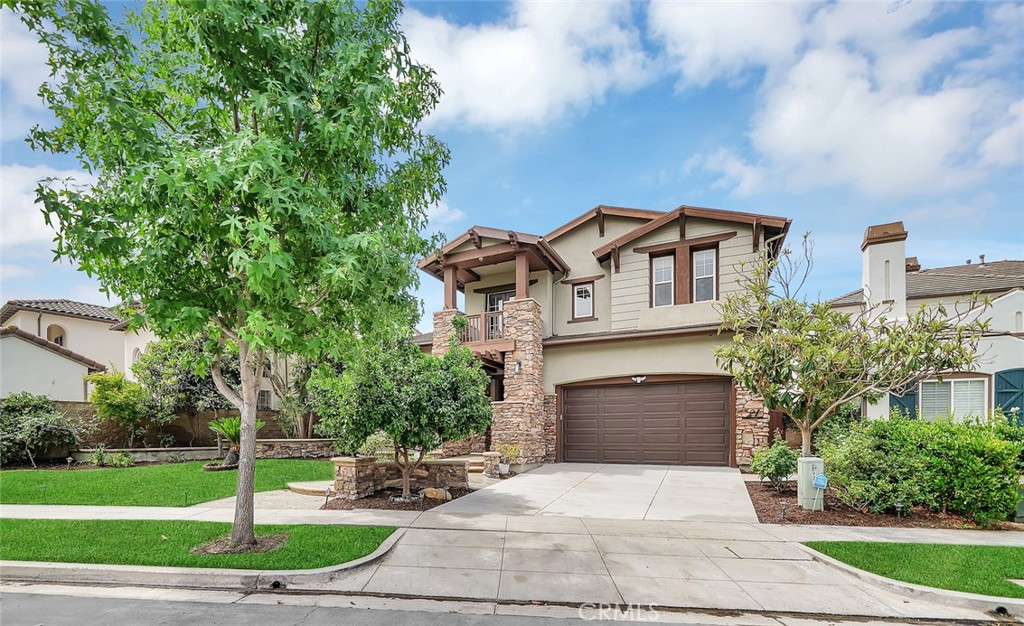 21 Wyndham Street Ladera Ranch, CA 92694 - Photo 1 of 1 a front view of a house with a yard and trees