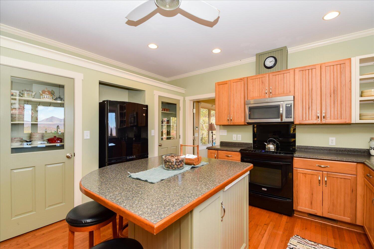 333 Hemlock Ridge Road Southeast Copper Hill, VA 24079 - Photo 24 of 45 a kitchen with stainless steel appliances granite countertop a sink a stove and refrigerator