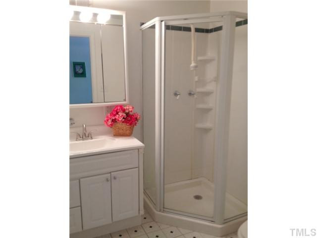 8812 Trailing Cedar Drive Raleigh, NC 27613 - Photo 20 of 25 Home office offers it's own full bath. New sink just installed! Bathroom