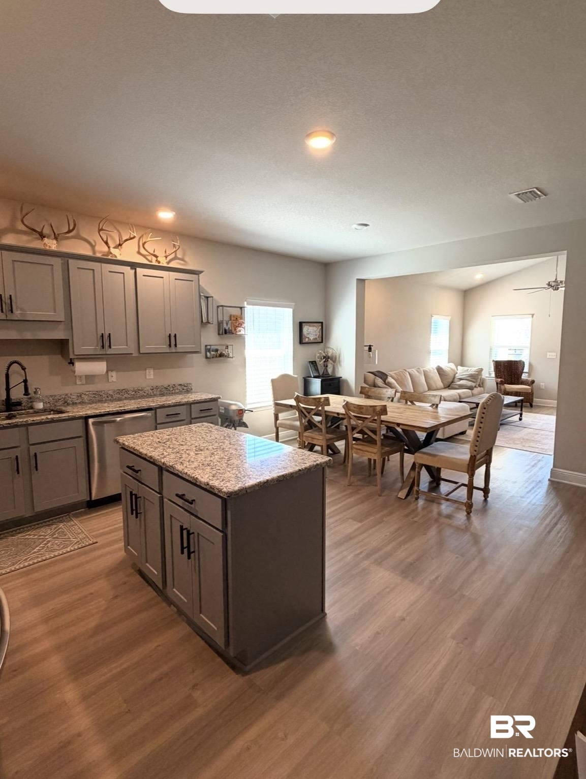 32215 Calder Court Daphne, AL 36527 - Photo 13 of 13 Kitchen with light stone countertops, dishwasher, dark wood finished floors, recessed lighting, and open floor plan