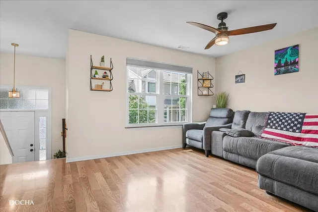 a bedroom with furniture and a large window