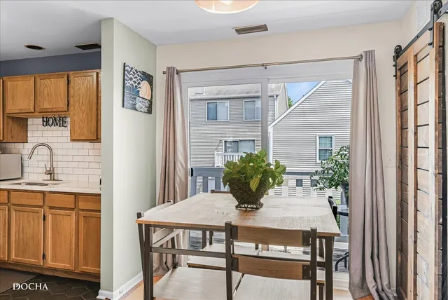 a view of a dining room with furniture and window