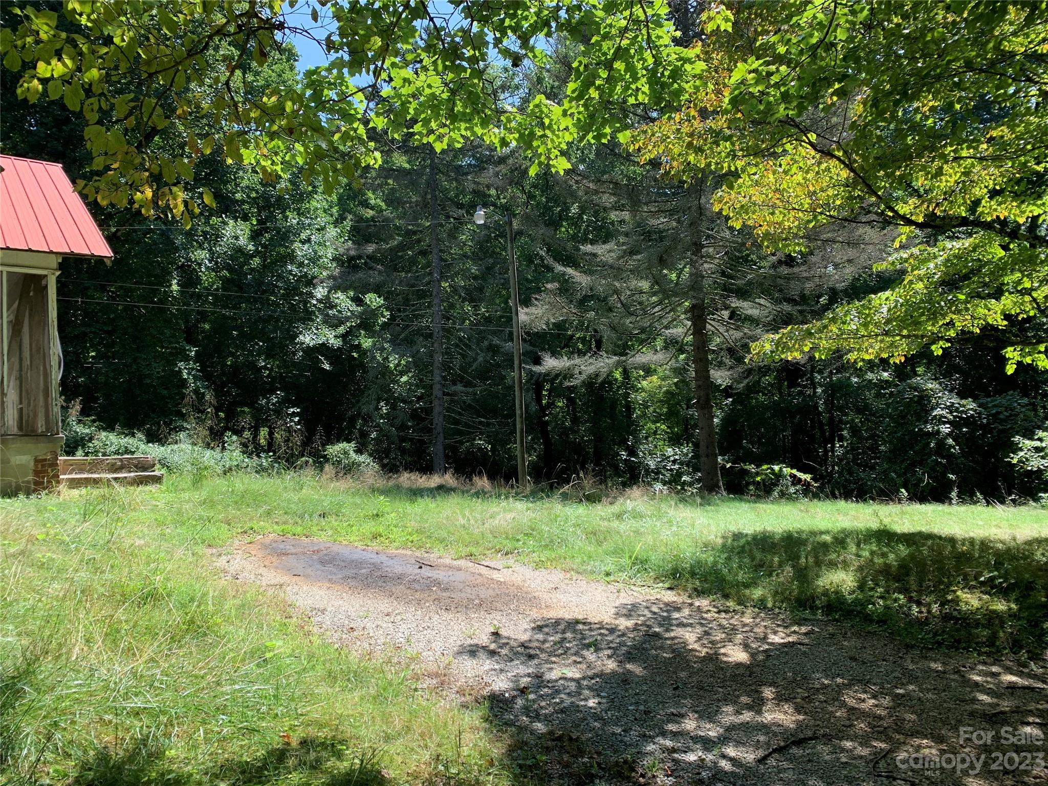 Tbd Tbd Brightwater Road, Unit 4 AND 5 Hendersonville, NC 28739 - Photo 5 of 8 a view of backyard with green space and trees