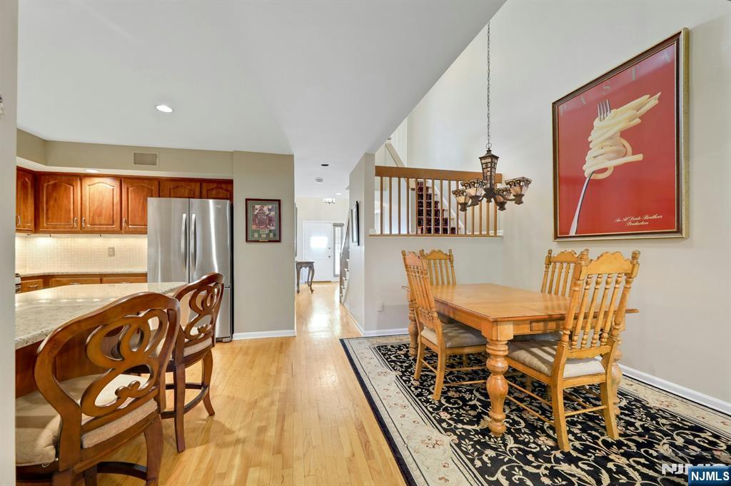 56 Longfellow Lane Mahwah, NJ 07430 - Photo 11 of 33 a view of a dining room with furniture window and wooden floor