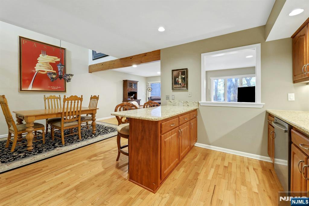 56 Longfellow Lane Mahwah, NJ 07430 - Photo 16 of 33 a room with wooden cabinets and painting on the wall