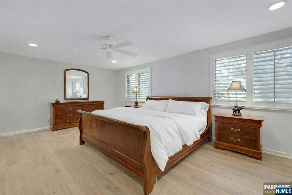 56 Longfellow Lane Mahwah, NJ 07430 - Photo 19 of 33 a spacious bedroom with a bed and a dresser in it