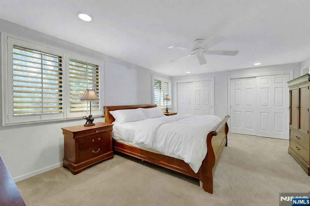 56 Longfellow Lane Mahwah, NJ 07430 - Photo 20 of 33 a spacious bedroom with a bed and a window