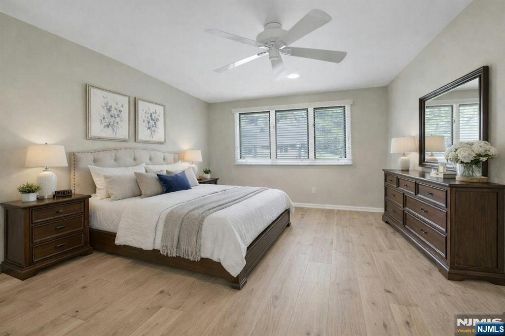 56 Longfellow Lane Mahwah, NJ 07430 - Photo 24 of 33 a spacious bedroom with a bed and dresser