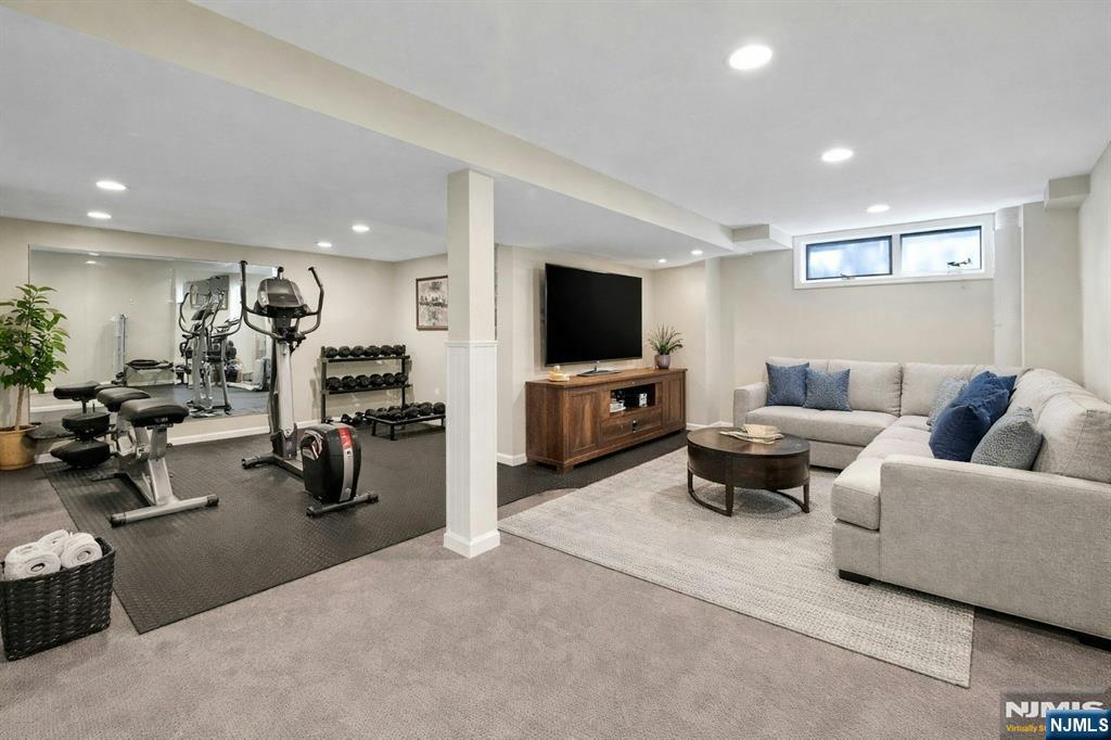 56 Longfellow Lane Mahwah, NJ 07430 - Photo 29 of 33 a living room with furniture and a flat screen tv