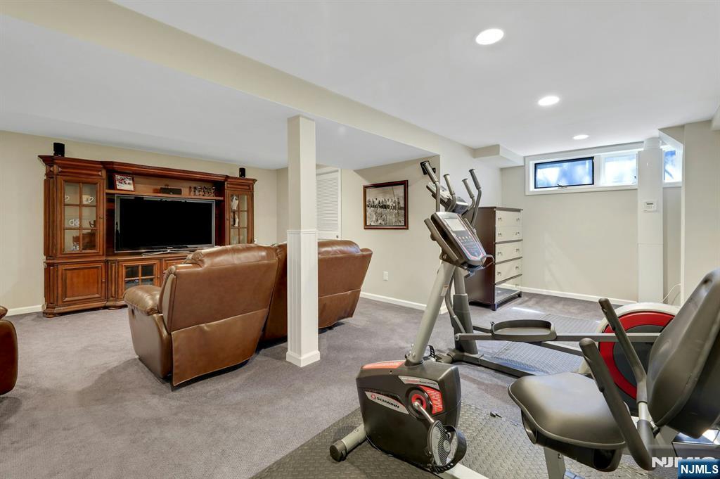 56 Longfellow Lane Mahwah, NJ 07430 - Photo 30 of 33 a room with furniture and a flat screen tv