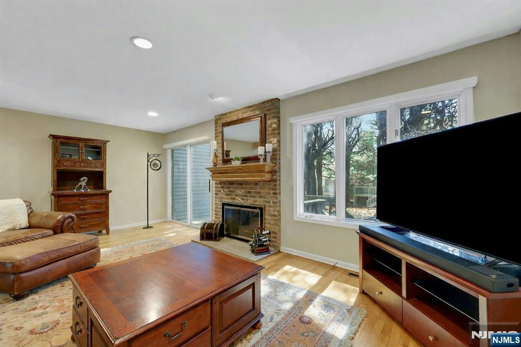 56 Longfellow Lane Mahwah, NJ 07430 - Photo 6 of 33 a living room with furniture fireplace and flat screen tv