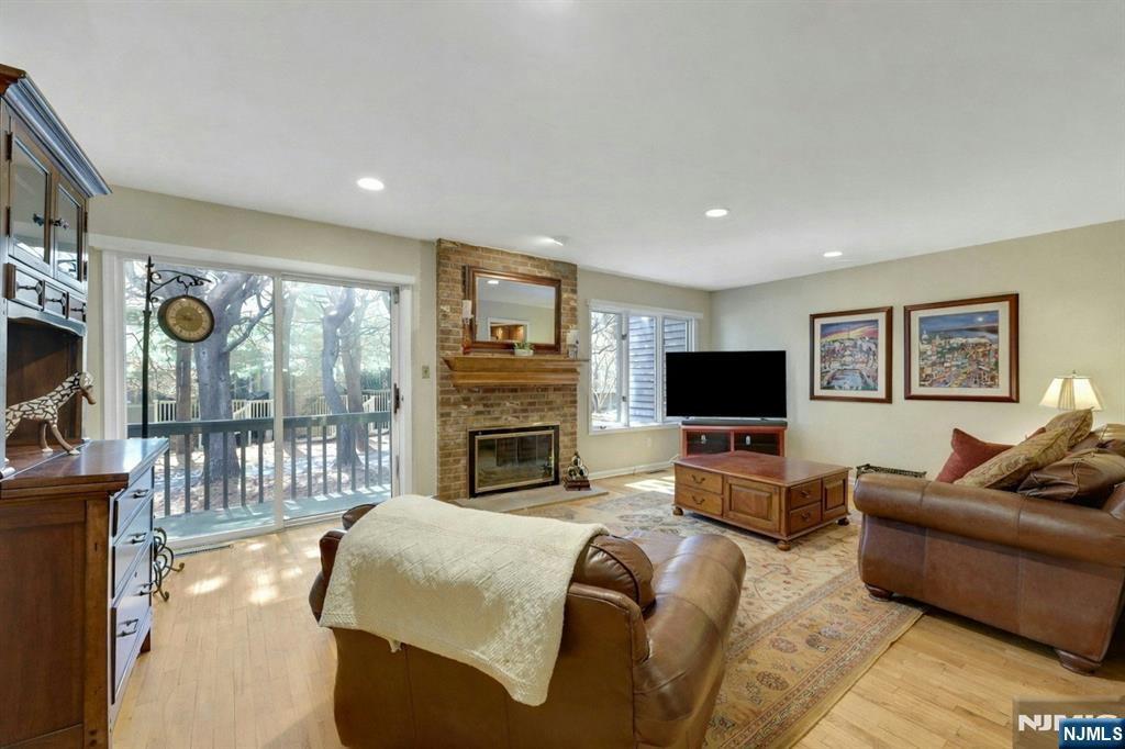 56 Longfellow Lane Mahwah, NJ 07430 - Photo 7 of 33 a living room with furniture fireplace and a flat screen tv