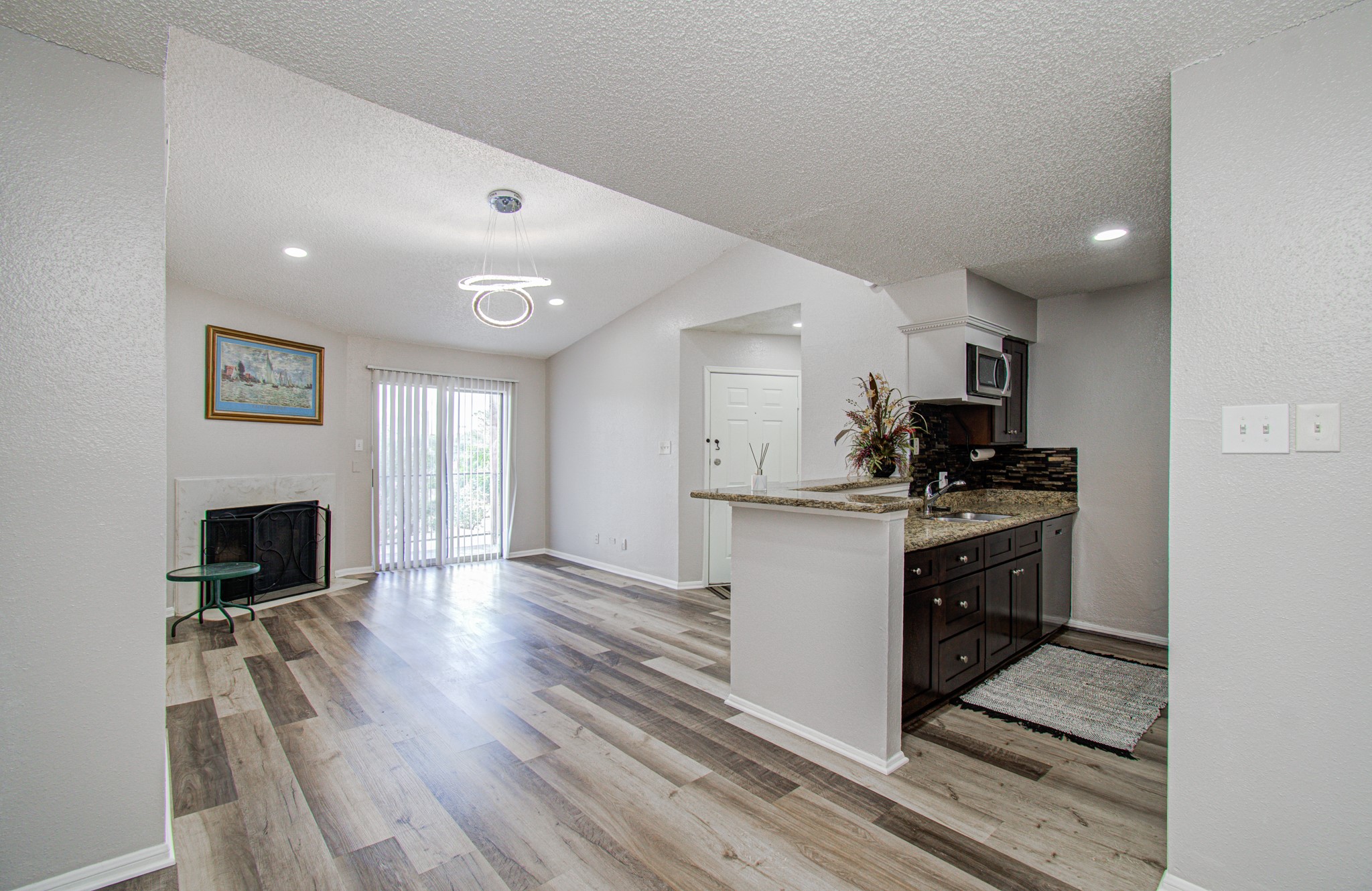 10101 South Gessner Road, Unit 405 Houston, TX 77071 - Photo 12 of 27 a kitchen with a refrigerator and a stove top oven