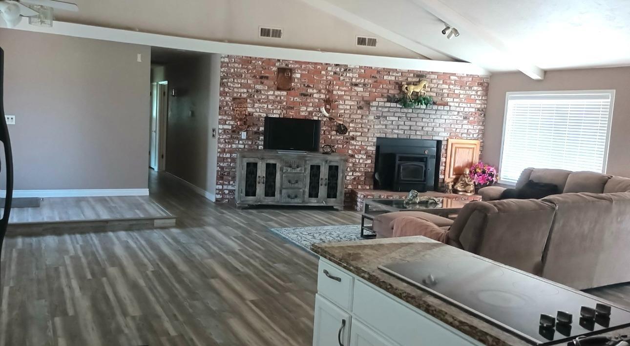 14728 Huntington Road Madera, CA 93636 - Photo 20 of 37 a living room with furniture and a fireplace